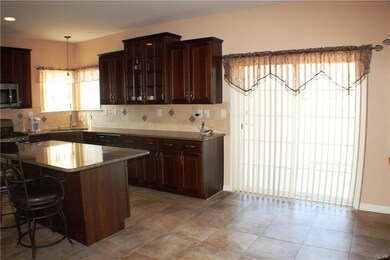 Sliding door to the back patio.  Stools at the cou