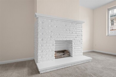 A decorative fireplace adds a cozy touch!