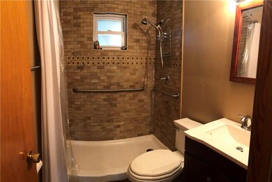 Main Floor Full Bathroom with step in shower.