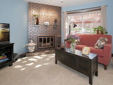 The spacious living room features a wood-burning f