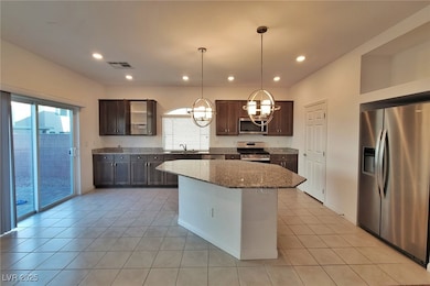 Kitchen featuring stainless steel appliances, a si