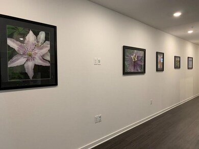 Hall featuring recessed lighting, dark wood finis
