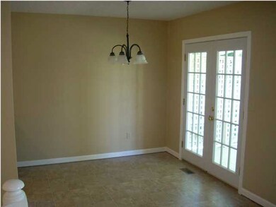 Dining room with French doors walking out to an ov
