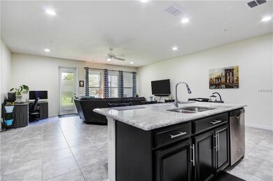 View of Family Room from Kitchen to show open conc