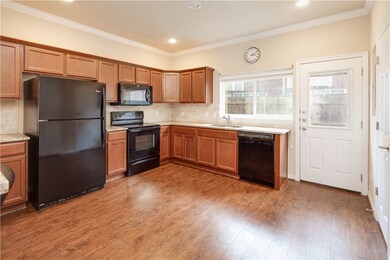 Kitchen featuring backsplash, wood finished floors