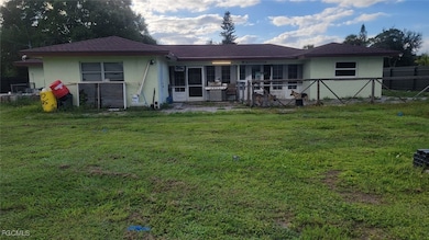 Rear view of property with stucco siding