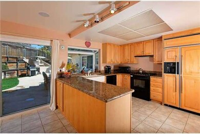 Remodeled kitchen hosts granite counters, maple ca