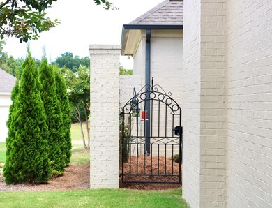 iron gate leading to side yard.