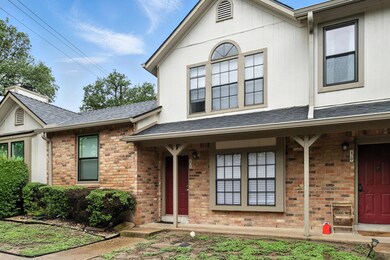 View of front facade with brick siding and a shin