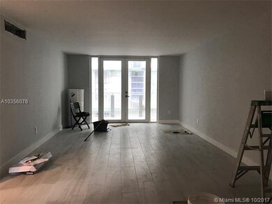 Large living room with hurricane impact doors lead