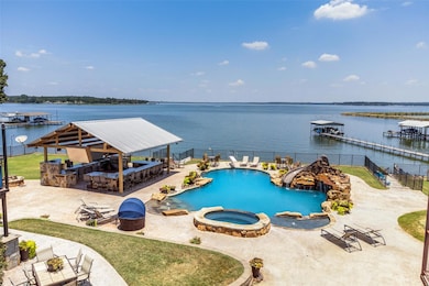 View of swimming pool with an in ground hot tub, a
