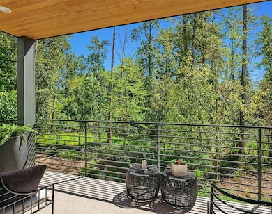 Covered outdoor living with beautiful views of the nature preserve