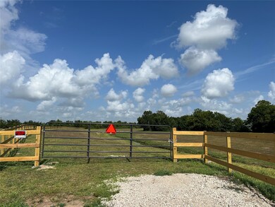 Your property is through this metal gate, and is set back off the road, so you will not be exposed to car traffic once you enter your gate.