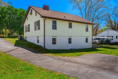 Rear photo of the back of this 3 level Home .. thi