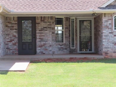 Main entry with storm door and entry to the office