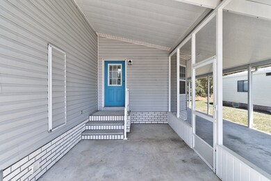 Front screened porch from driveway entry