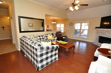 A cozy gas log fireplace highlights the family-siz