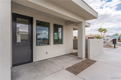 Entrance to property with a patio area