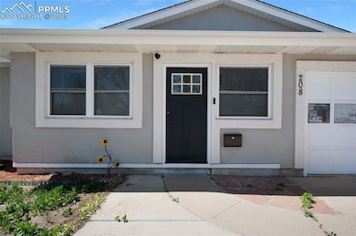 Doorway to property with stucco siding
