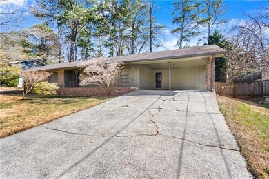 View of front facade featuring brick siding, an at