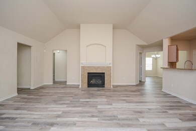 Ample living room! Enjoy the cozy fireplace
