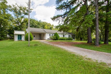 This property features a 2 car carport and a shed.