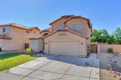 5741 W Comet Ave-large-002-26-Front Exte