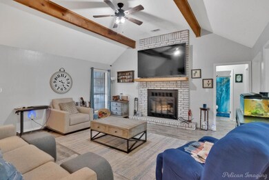 Living area with wood finished floors, visible ven
