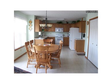Large eat-in kitchen opens to living room and doub