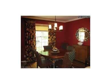 Dining Room Features Hardwood Floors and Crown Mol
