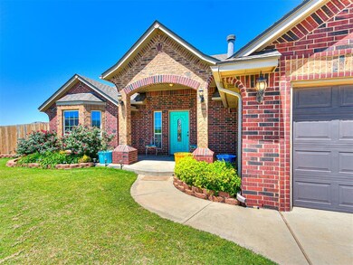 View of front of house with a garage and a front y