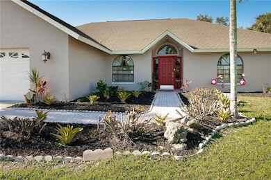 Ranch-style house with an attached garage, stucco