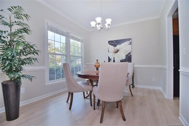 Formal dining room with new wood laminate floors, 