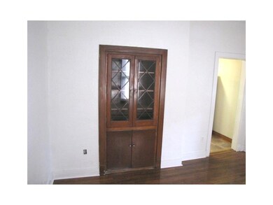 Dining Room. Charming built-in cupboard and hardwo