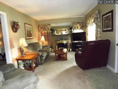 Custom stone mantle on the stone fireplace, in thi