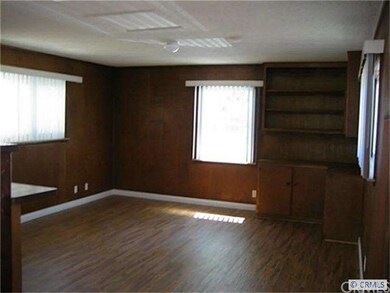 Large family room with shelves open to kitchen. Ne