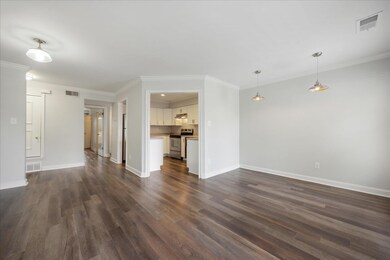 Unfurnished living room with dark hardwood / wood-