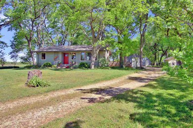 Circle drive, front porch and great landscaping ar