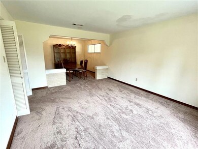 Front living room and adjacent dining room