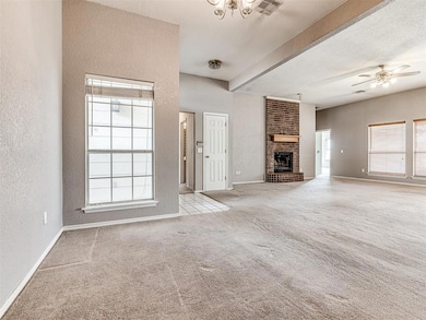 Unfurnished living room with beamed ceiling, plent