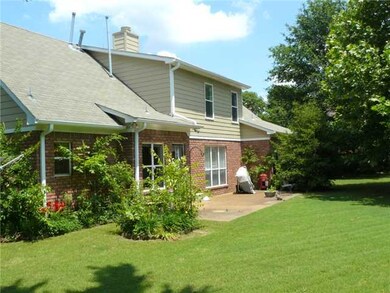 Relax on the back patio overlooking the private ba