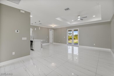 Spare room with a raised ceiling, visible vents, c
