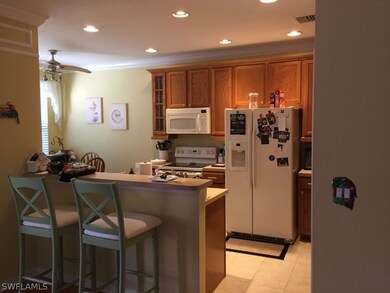Kitchen with bar and breakfast eating area.