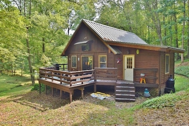 Charming 3 bedroom log sided home on 8.56 wooded acres in the Whispering Pines community at Atwood Lake.