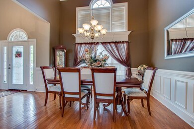 Light filled dining area with blinds to protect the furniture and floors