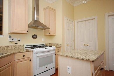 Kitchen - center island, stainless steel hood, gas