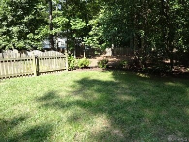 View from patio of private fully fenced level back