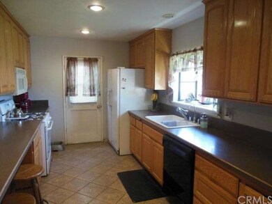 Kitchen with access to side yard