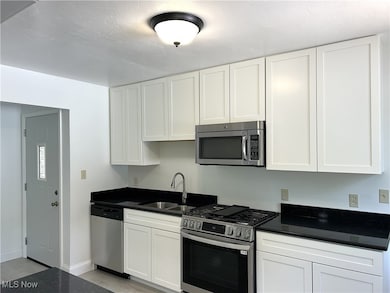 Completely updated Kitchen with white cabinets and soft close drawers. Quartz countertops.