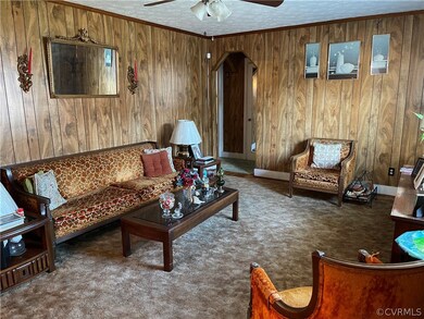 SPACIOUS SUNNY LIVING ROOM WITH HARDWOOD FLOORING